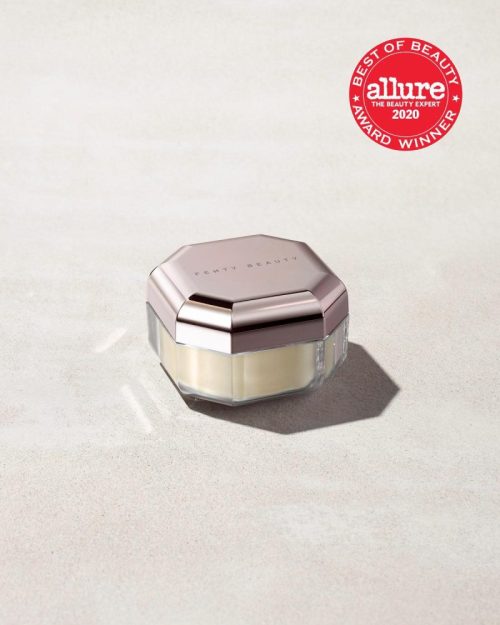 Closed container of Pro Filt'r Instant Retouch Setting Powder in shade butter on a concrete background. Allure best of beauty award winner 2020 badge on the top right.