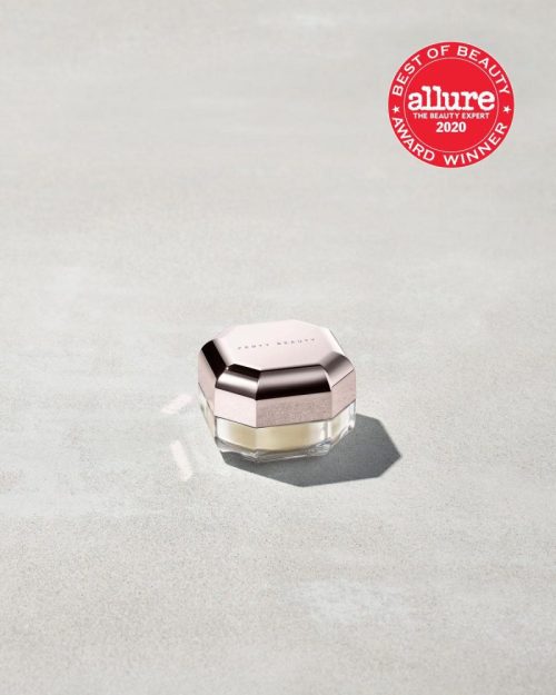 Closed container of Pro Filt'r Mini Instant Retouch Setting Powder in shade butter on a concrete background. Allure best of beauty award winner 2020 badge on the top right.